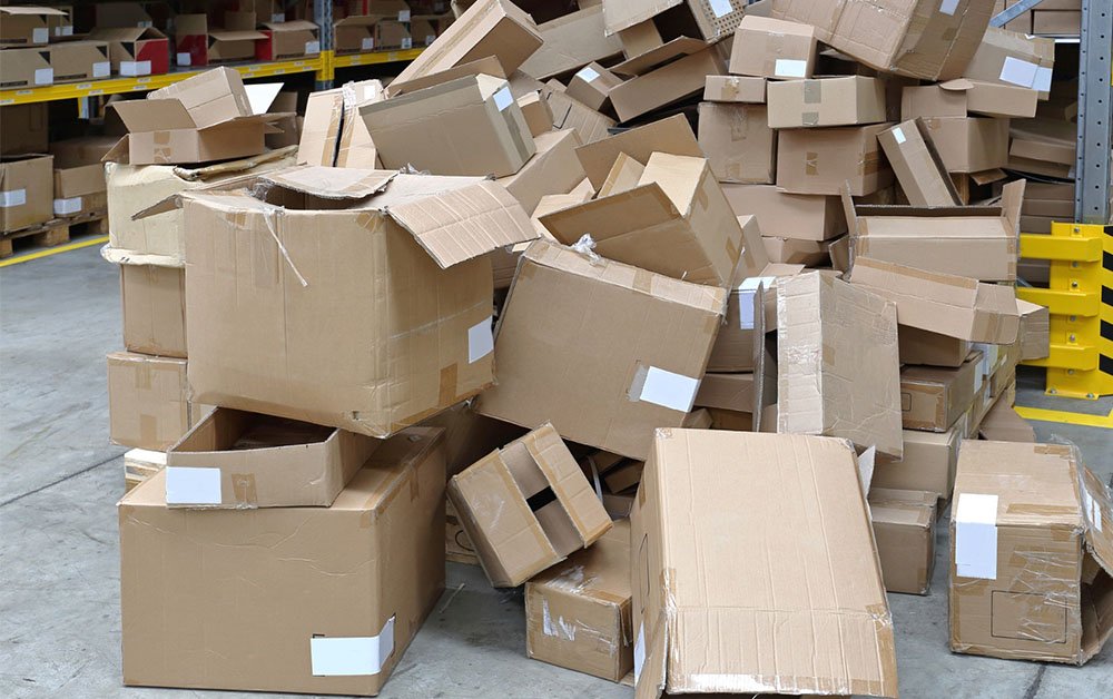 Pile of degraded logistics packaging boxes