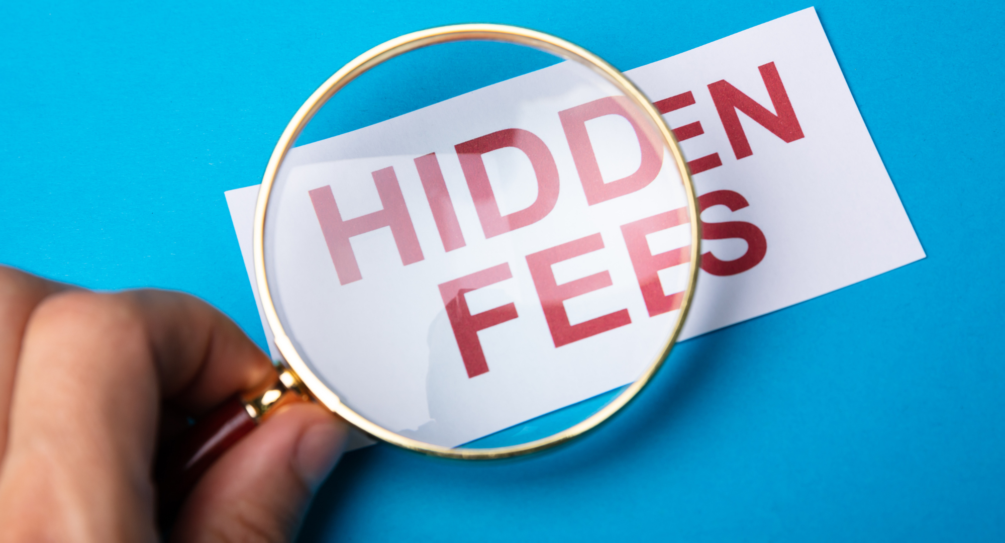 Magnifying glass searching for "hidden fees" in a Logistics RFP. Don't miss out! Read our guide to uncovering hidden costs.